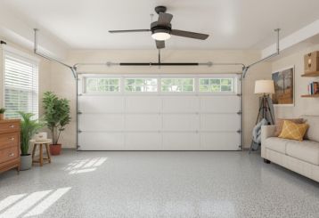 Modern garage interior transformed into a comfortable living space with custom garage organization in Chaska, MN