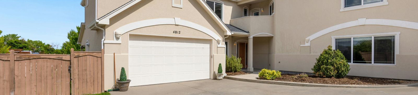 Residential garage door front entrance in Chaska, MN with driveway and landscaping