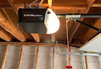 LiftMaster myQ Wi-Fi garage door opener installed on a sectional garage door ceiling in Bloomington, MN home.