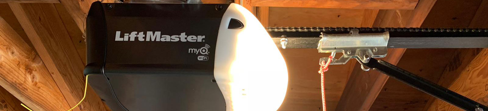 LiftMaster myQ Wi-Fi garage door opener installed on a sectional garage door ceiling in Bloomington, MN home.